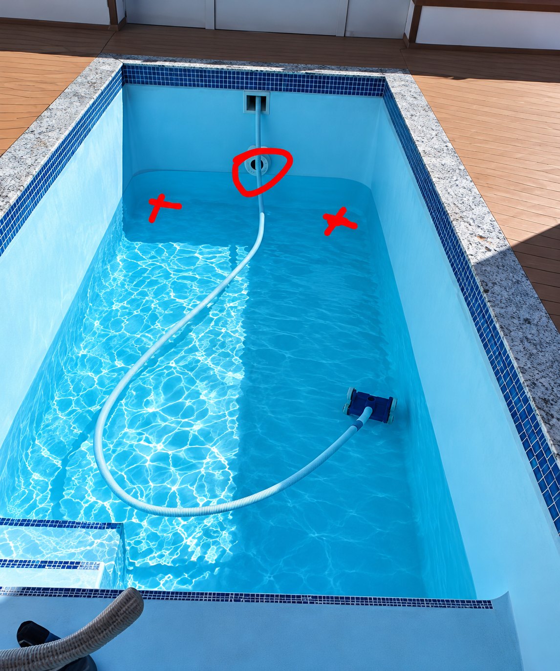 Swimming pool with leak points marked during a leak detection inspection